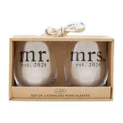 A set of two stemless wine glasses in a gift box from Mud Pie. It reads "SET OF 2 STEMLESS WINE GLASSES"