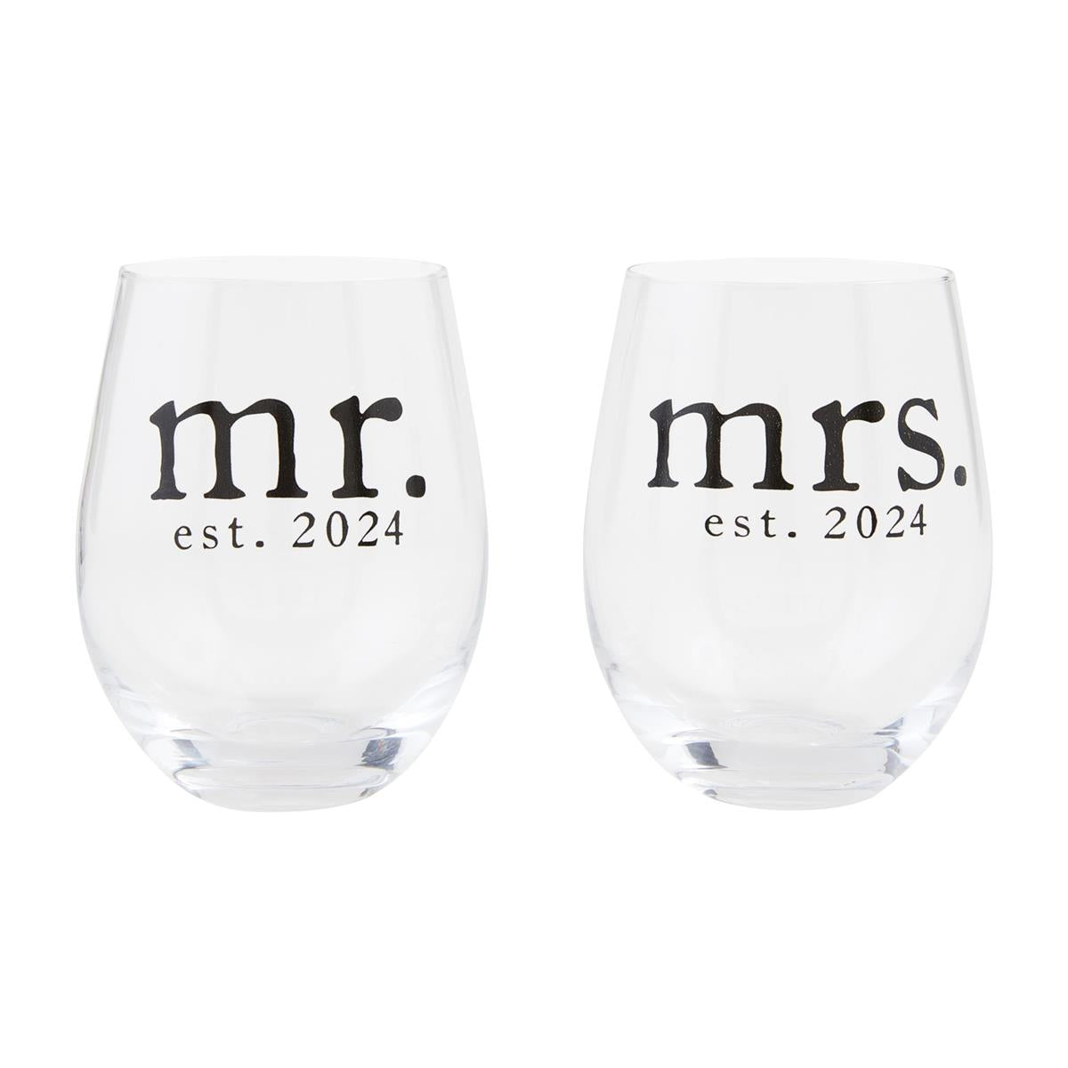 A set of two stemless wine glasses made of glass. One reads "mr. est. 2024" the other reads "mrs. est. 2024"