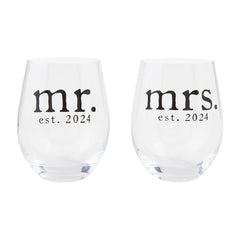 A set of two stemless wine glasses made of glass. One reads "mr. est. 2024" the other reads "mrs. est. 2024"