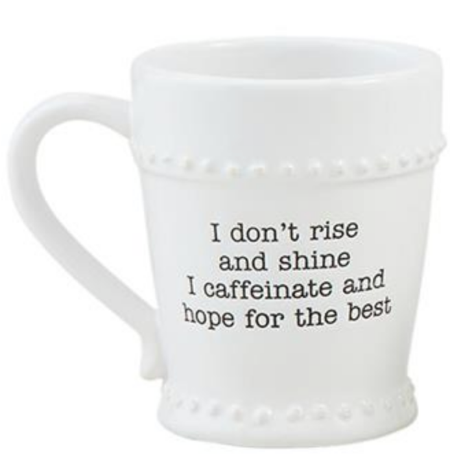 This Mud Pie coffee mug reads, "I don't rise and shine I caffeinate and hope for the best."