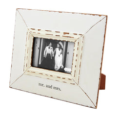 A white picture frame that reads "Mr. and Mrs." from Mud Pie.