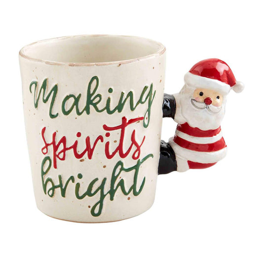 A coffee mug that reads "Making Sprits Bright" with Santa Clause as the handle. 1200