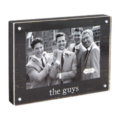 A black magnetic picture frame that reads "the guys" from Mud Pie.