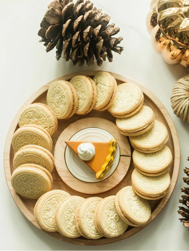A Nora Fleming Maple Cracker Round.