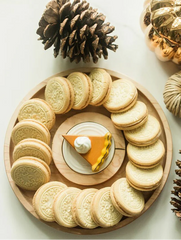 A Nora Fleming Maple Cracker Round.
