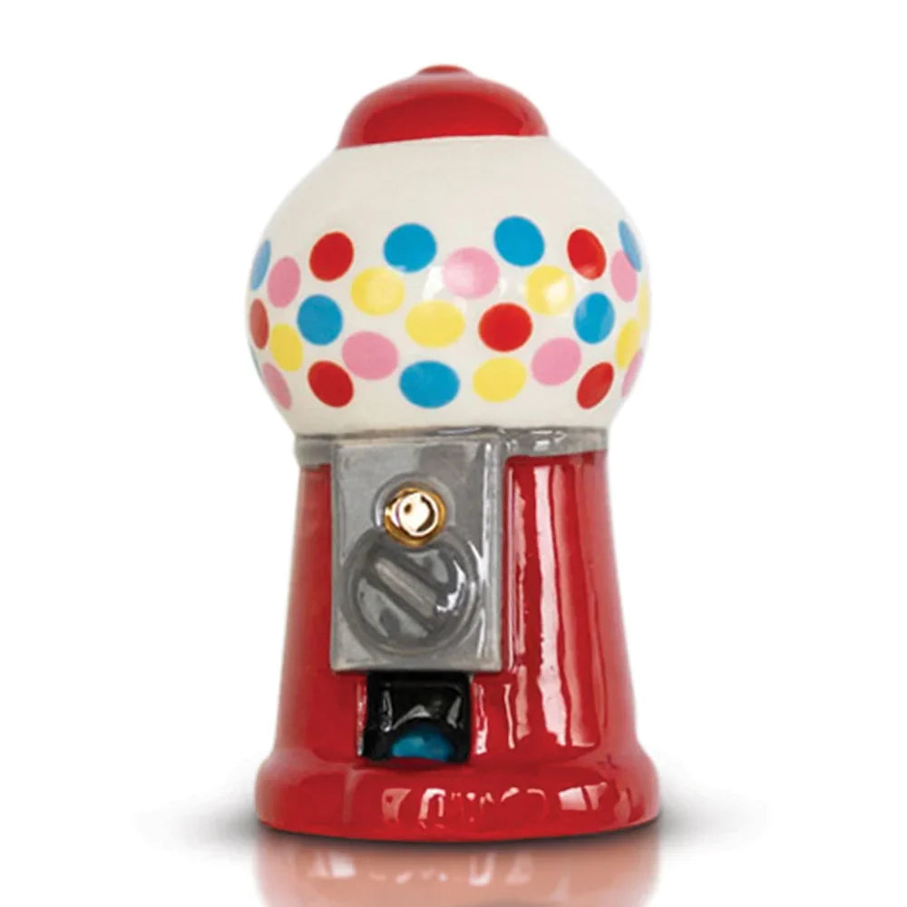 A Nora Fleming Mini that's an old fashion gum ball dispenser. 