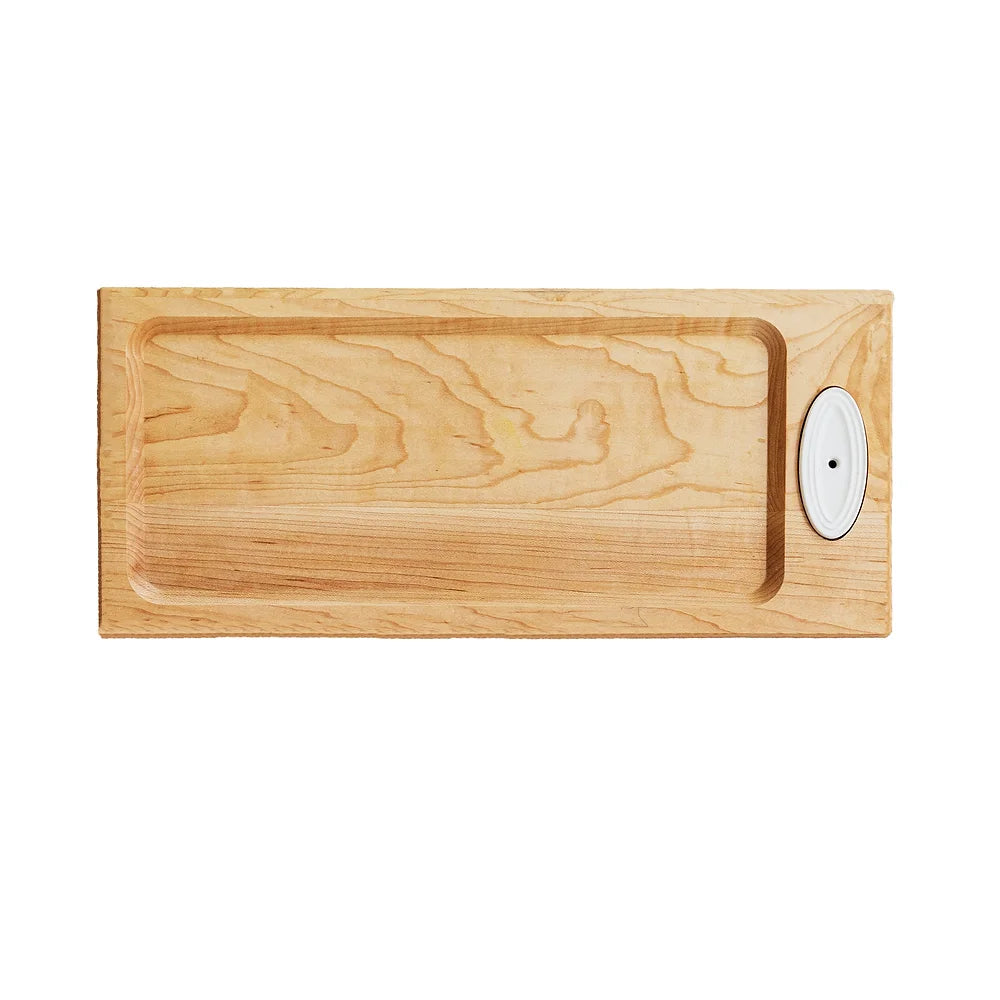 A full view of a maple wood bread board designed by Nora Fleming. With a slot for a Nora Fleming Mini to be displayed. 