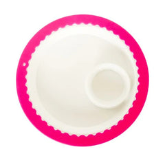 Nora Fleming Band Together Pink (Pink silicone band) around a white platter.