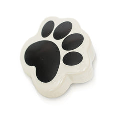 A black dog paw print mini from Nora Fleming.