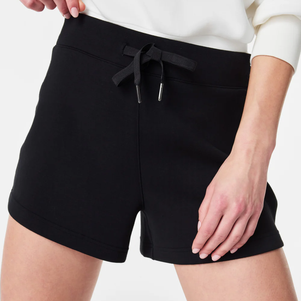 A close up view of the SPANX airessentials women's shorts in the color black. Showing a drawstring.