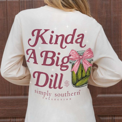 Women's long sleeve t-shirt that reads, "Kinda Big Dill Simply Southern Collection." With a jar of green pickles beside the lettering. The jar has a pink ribbon. The Simply Southern logo is shown at the bottom of the back of the shirt, and on the sleeve.