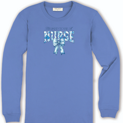 The front of an all blue long sleeve t-shirt. Directly in the middle of the chest the phrase, "Blessed to be a nurse: with a blue ribbon.