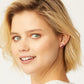 A model wearing a Ladybug mini post earring in her left ear.