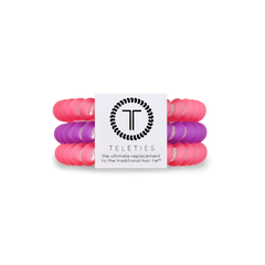 A pack of three small women's hair ties. Two color pink, one color purple. From TELETIES.