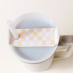 Tumbler Lid Tag from the Darling Effect in the color peach, with a checkered square pattern.