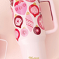 The Darling Effect 40 oz Take Me Everywhere Tumbler in the color pink. Showing pink Christmas ornaments and The Darling Effect logo. 