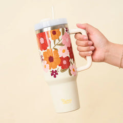 The Darling Effect 40 oz Take Me Everywhere Tumbler in cream. Featuring a floral pattern and The Darling Effect logo.
