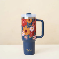 The Darling Effect 40 oz Take Me Everywhere Tumbler in Navy blue, featuring a floral pattern and The Darling Effect logo.