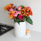 Utensil Croc Stripes with flowers inside, and a pumpkin mini attachment.