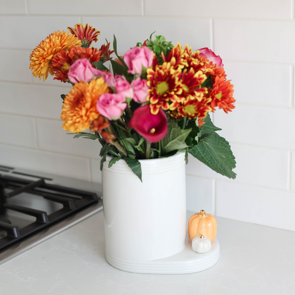 Utensil Croc Stripes with flowers inside, and a pumpkin mini attachment.