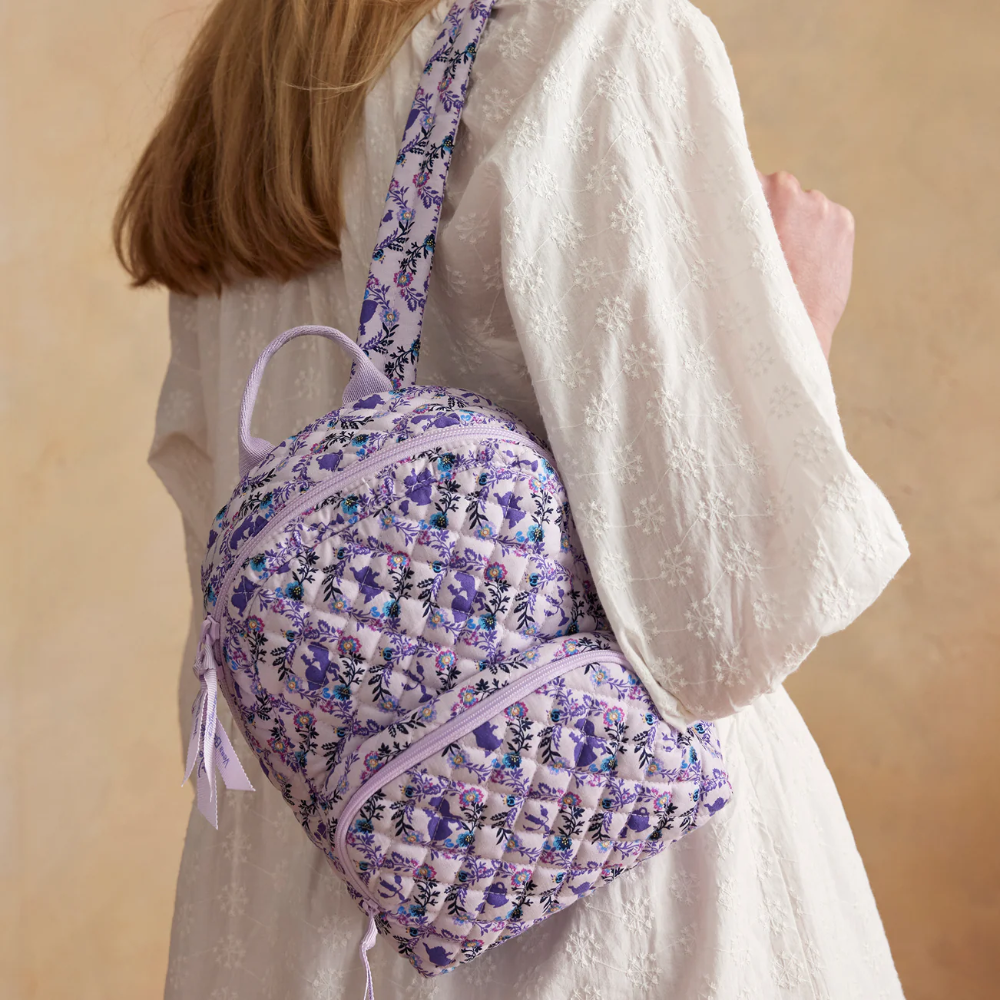 Vera Bradley mini backpack in the color purple, featuring Disney's Belle.