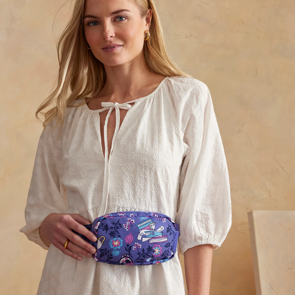 Purple color Vera Bradley fanny pack with a Disney Belle theme.