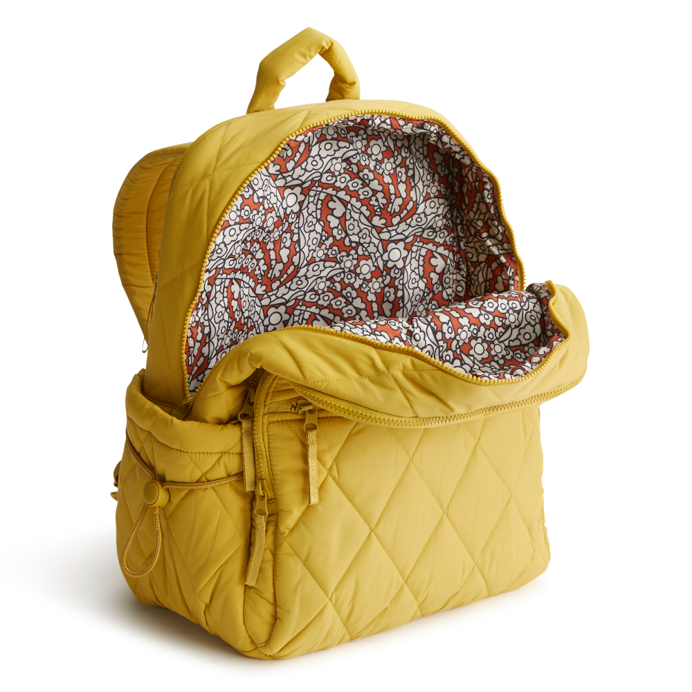 A Nylon fabric large size backpack from Vera Bradley in the color gold. The pattern name is Golden Olive.