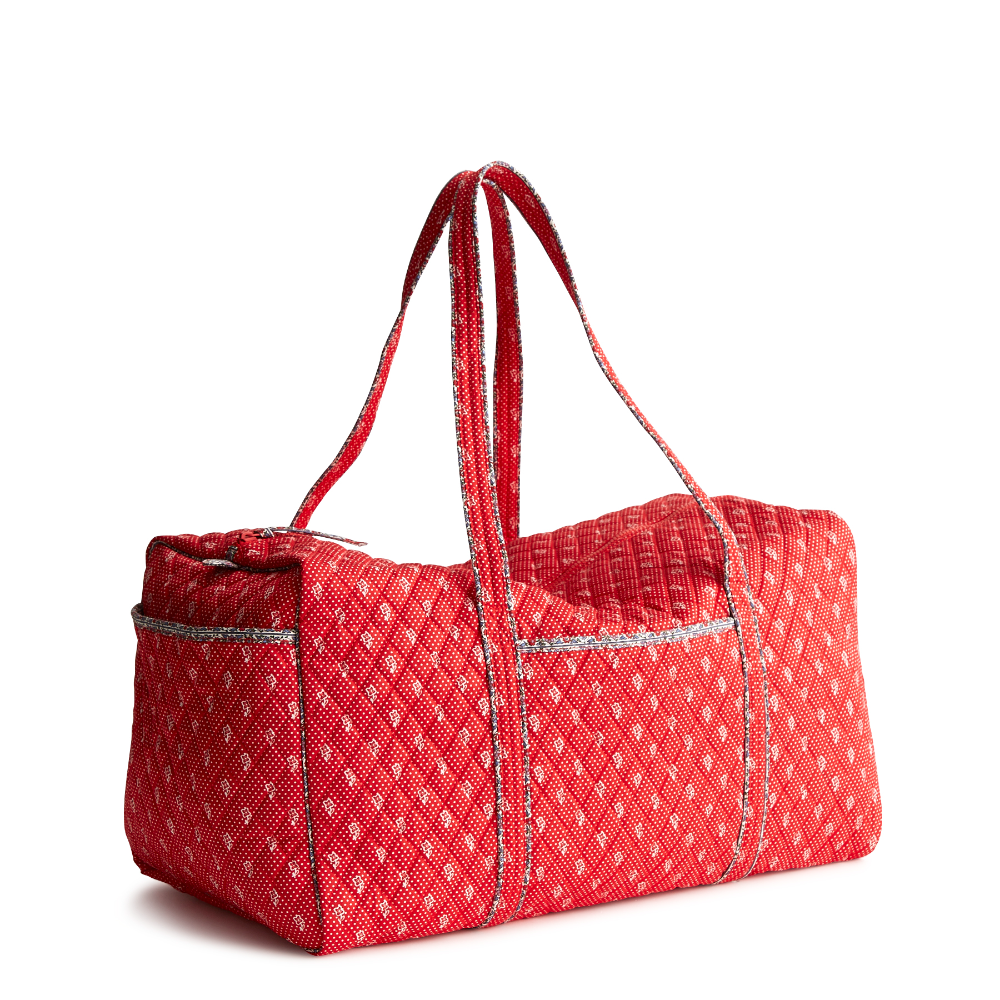 A large size duffel bag in the color red, made from Vera Bradley in Cotton Gabardine fabric.