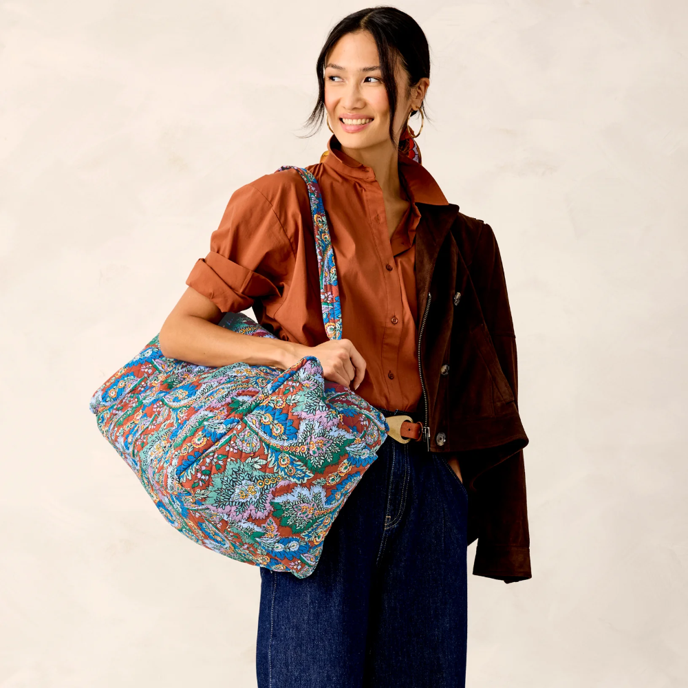 Vera Bradley duffel bag in Flowers + Feathers pattern.