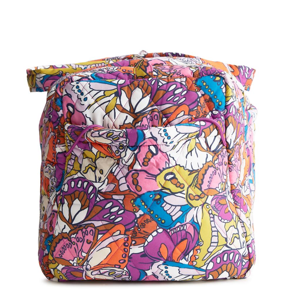 A large duffel bag designed by Vera Bradley in the colors pink, yellow, and blue. The bag is designed with nylon fabric.