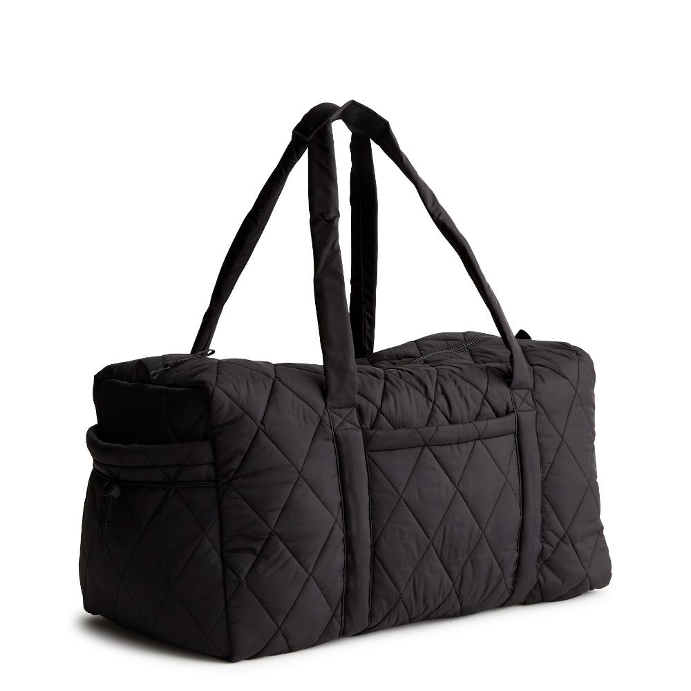 A large duffel bag designed by Vera Bradley in the color black. The bag is designed with nylon fabric.