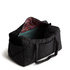 A large duffel bag designed by Vera Bradley in the color black. The bag is designed with nylon fabric.