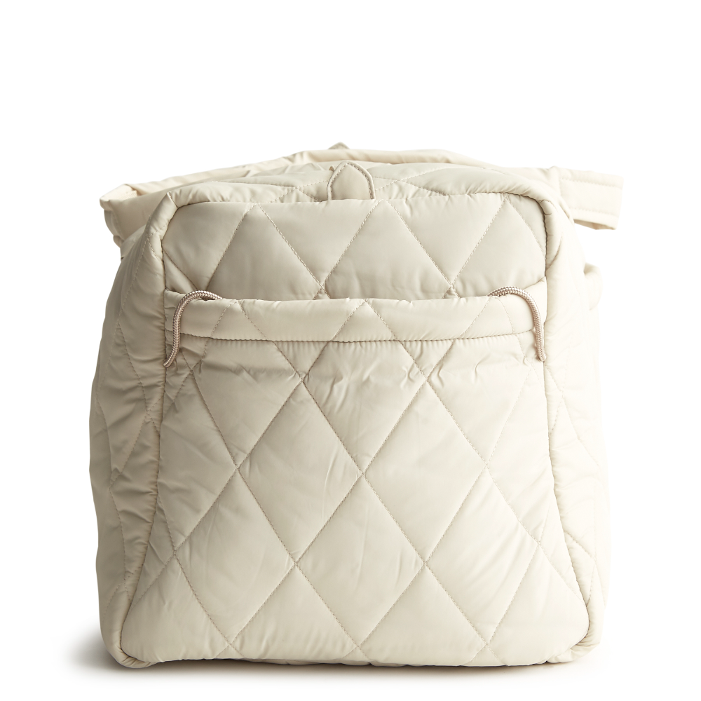 A large duffel bag designed by Vera Bradley in the color white. The bag is designed with nylon fabric.