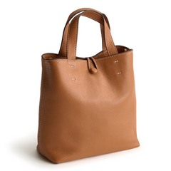 A tan leather mini tote bag from Vera Bradley.