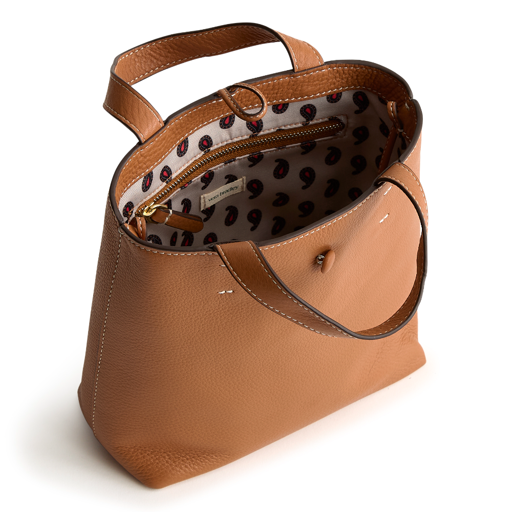 A tan leather mini tote bag from Vera Bradley.
