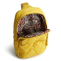 A Vera Bradley sling backpack in Golden Olive.