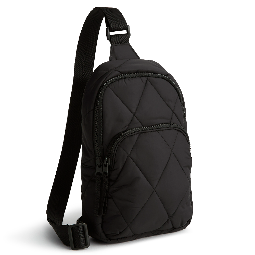 A Vera Bradley sling backpack in Moonless Night.