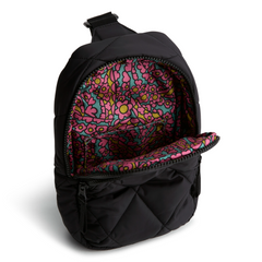 A Vera Bradley sling backpack in Moonless Night.