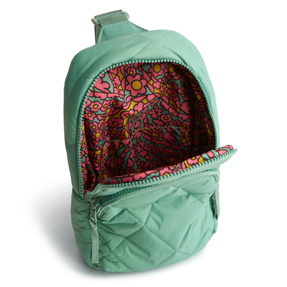 A Vera Bradley sling backpack in Beryl Green.