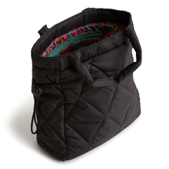 A mini Vera Bradley original tote bag in the pattern Moonless Night.