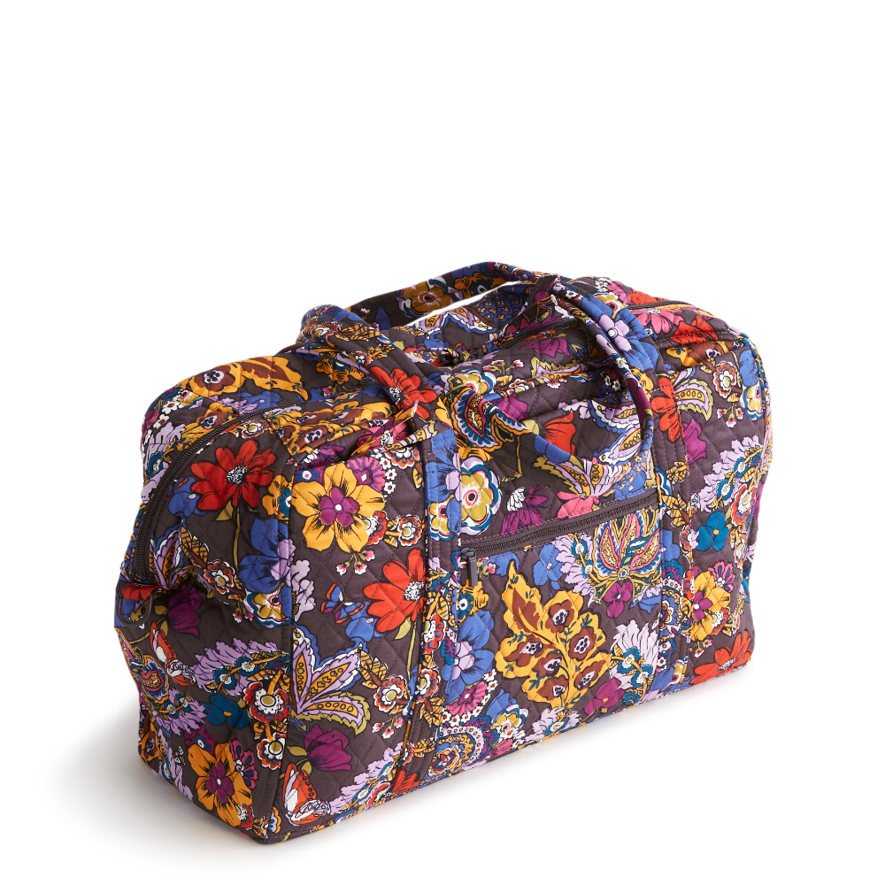 A Vera Bradley Weekender duffel bag in the pattern Colorful Bouquet.