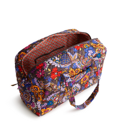 A Vera Bradley Weekender duffel bag in the pattern Colorful Bouquet.