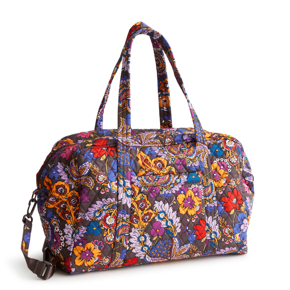 A Vera Bradley Weekender duffel bag in the pattern Colorful Bouquet.