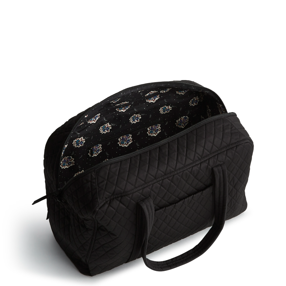 A Vera Bradley Weekender duffel bag in the pattern Moonless Night.