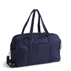 A Vera Bradley Weekender duffel bag in the pattern Peacoat.