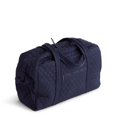 A Vera Bradley Weekender duffel bag in the pattern Peacoat.