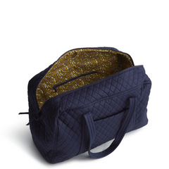 A Vera Bradley Weekender duffel bag in the pattern Peacoat.