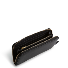 An interior view of a leather wristlet wallet in color moonless night, designed by Vera Bradley. The wallet offers several card slip pockets, and one interior hidden pocket with a gold zipper for your cash. This wristlet is from the Vera Bradley New Day collection.