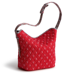 A red shoulder bag from Vera Bradley in the New Day Vera Bradley Dotty Floral Pattern.