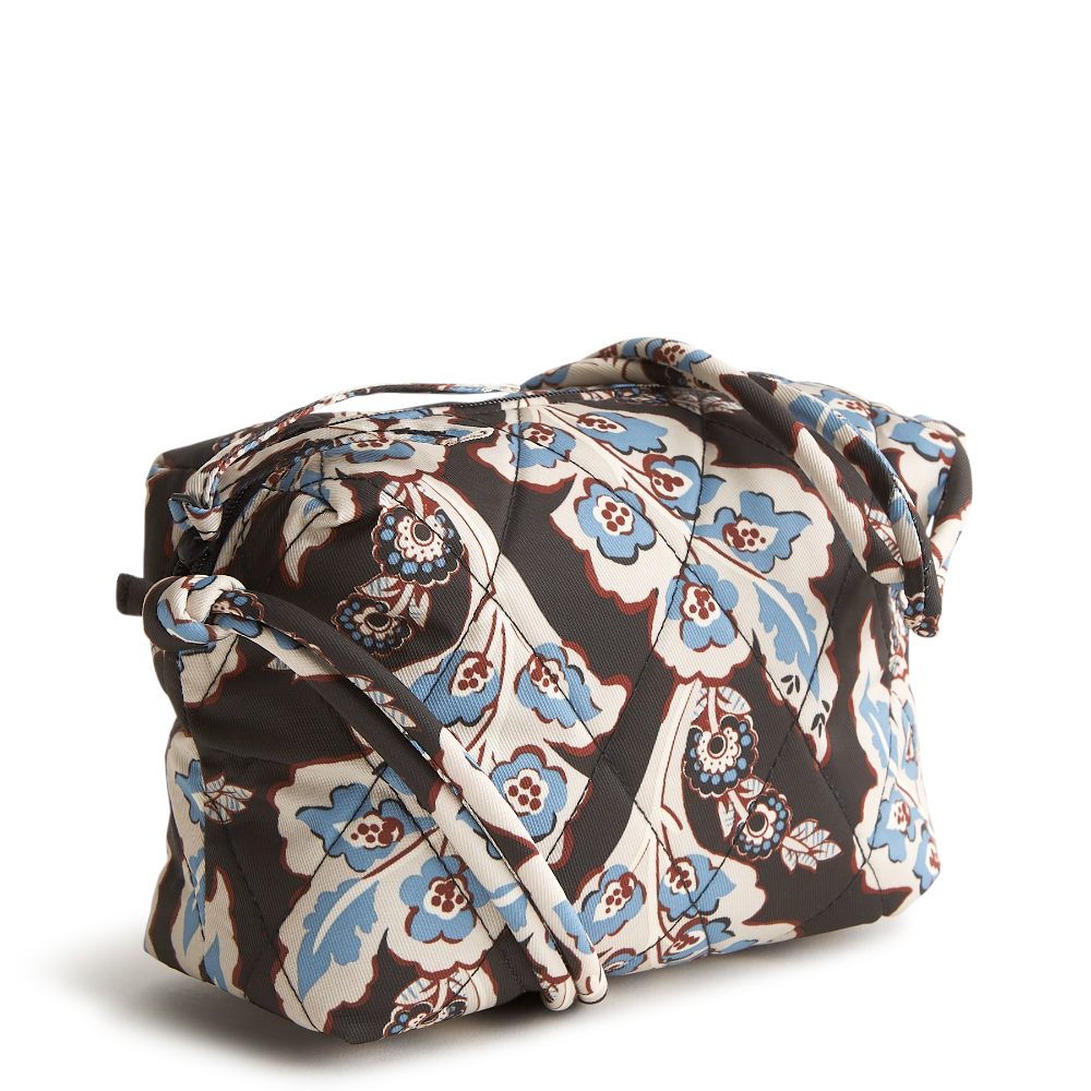 Designed for the minimalist at heart, this compact and versatile bag offers the perfect blend of style and functionality for those who prefer to travel light. The bag is shown in Vera Bradley's New Day Pattern, Calyx Quil Black.